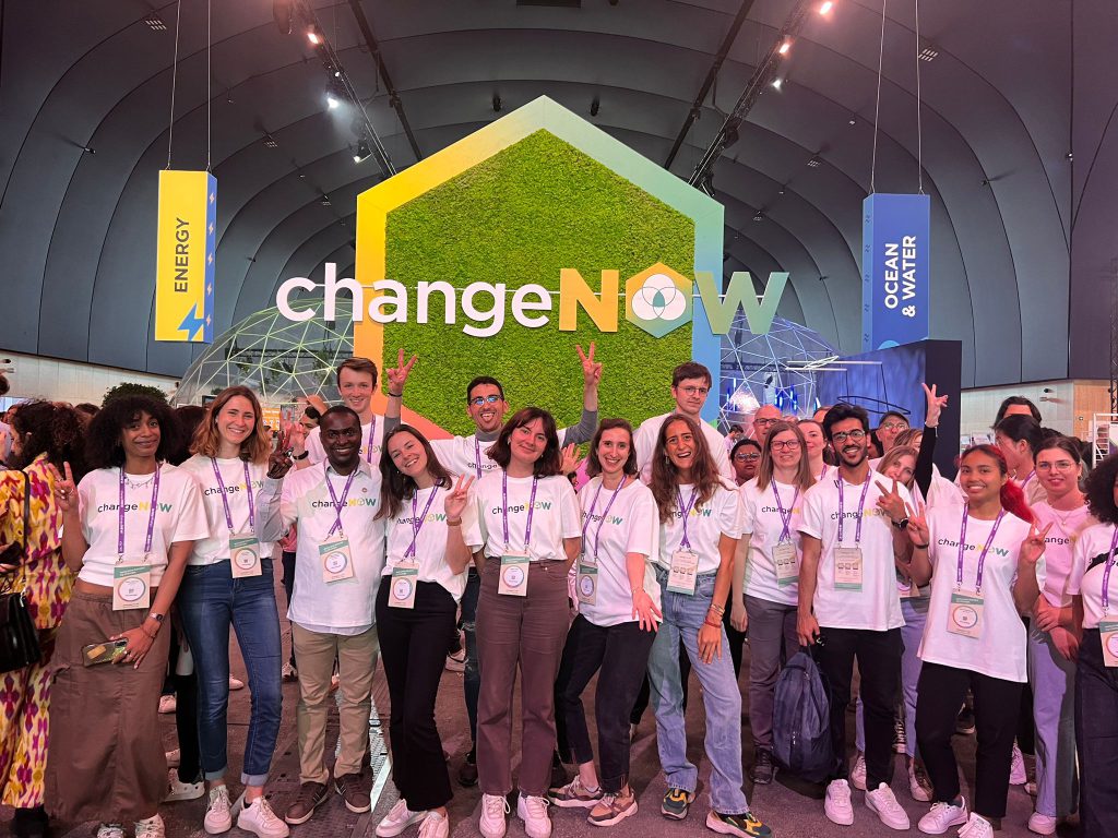 Volunteers at ChangeNow wearing white t-shirts made with NOOSA™ circular fiber.