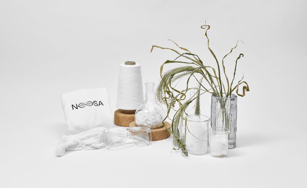 Various elements representing the NOOSA™ brand such as a t-shirt, fiber, filament and yarn.